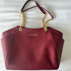 Michael Kors shoulder bag with gold hardware and wallet